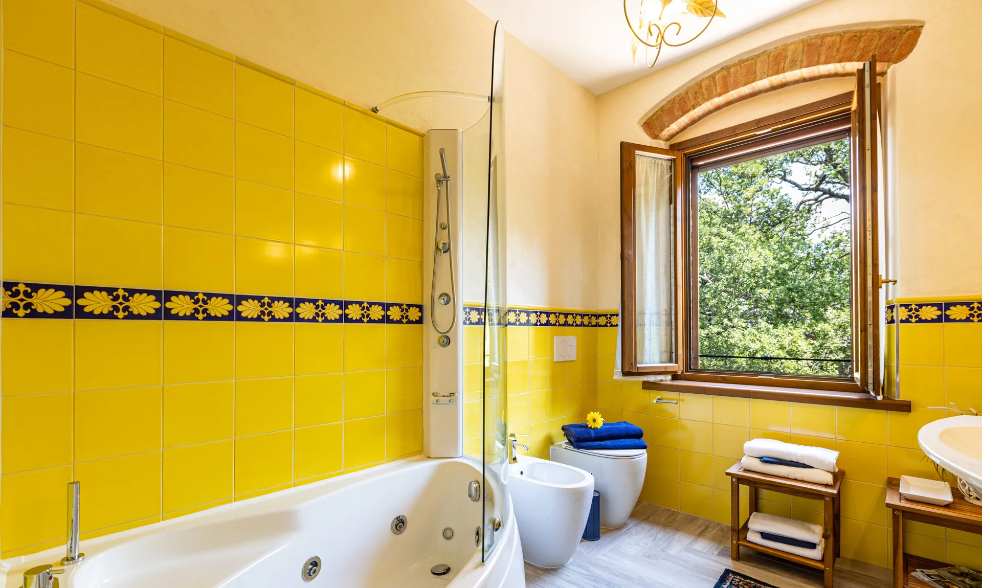 Bathroom with hot tub inside Camelia room at Tenuta di Macericca holiday farm