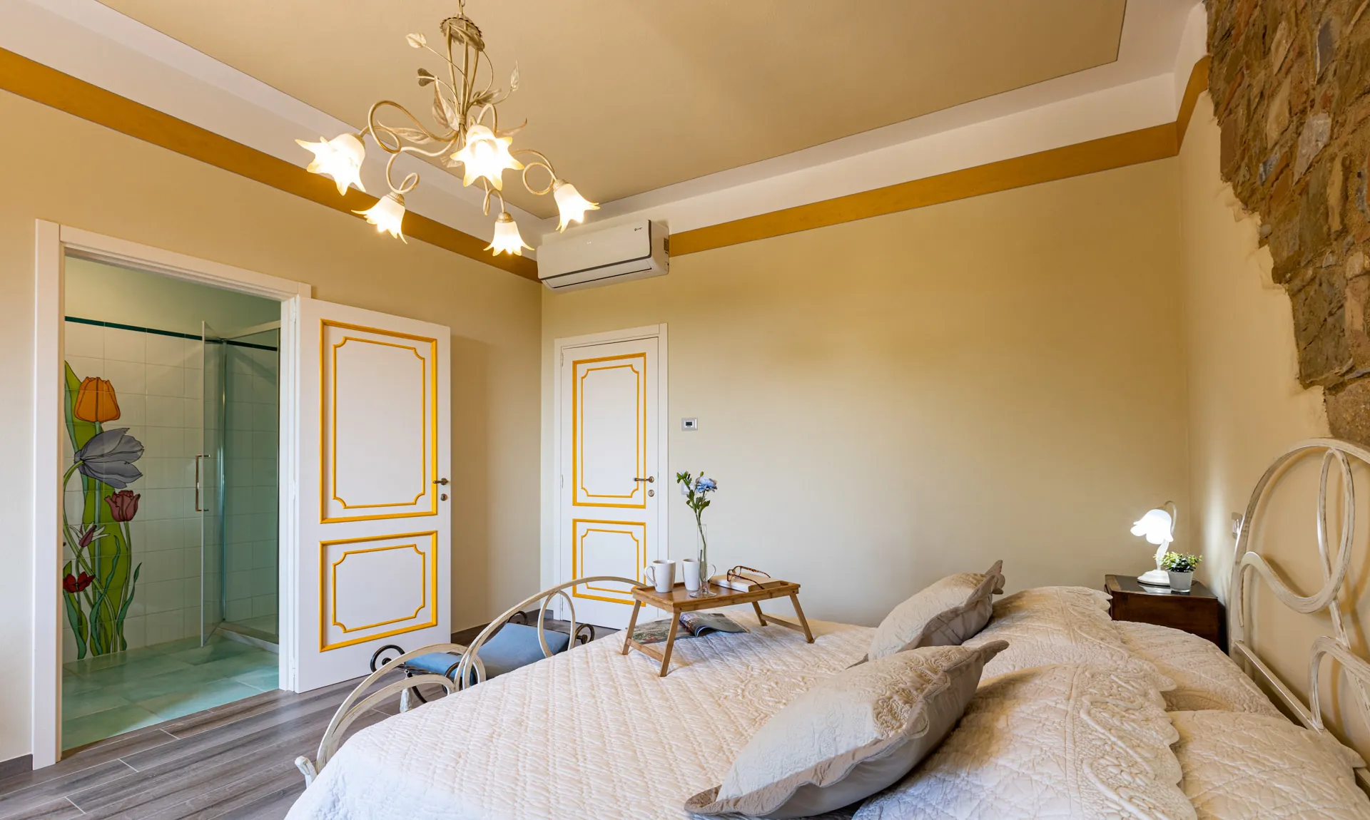 Wide view of Mimosa room with bathroom at Tenuta di Macericca holiday farm
